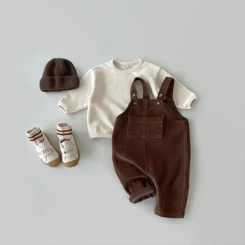 2025 Vêtements pour nouveau-né Combinaison en velours côtelé pour garçon Combinaisons d’automne et d’hiver Barboteuse pour fille Pantalon à bavoir décontracté Salopette Vêtements pour bébés